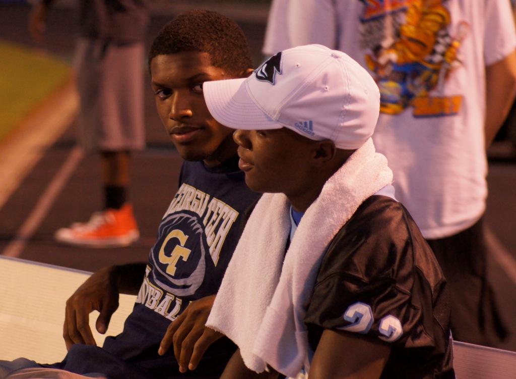 Junior John Smith gets moral support from former Panther Jeffrey Greene, who is a wide receiver for the Georgia Tech Yellow Jackets.