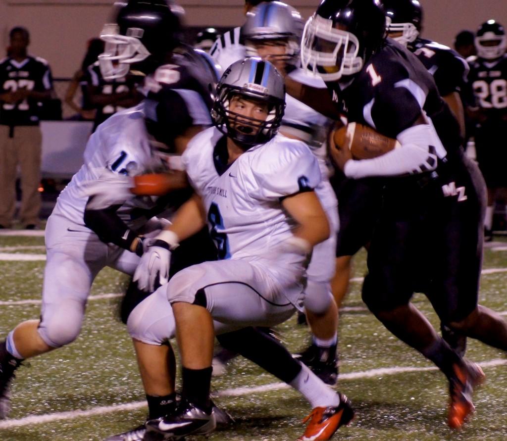 Junior outside linebacker Connor Dillon rolls off a block to make a tackle Friday night against Mt. Zion. The Panther defense held the Bulldogs to 88 yards on 27 carries and recovered two fumbles. 