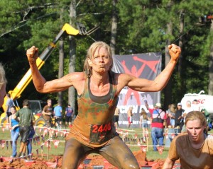 Covered in mud from head to toe doesnt slow down Jenny Kelly as she makes her way through the obstacle course at the Gladiator Rockn Run.
