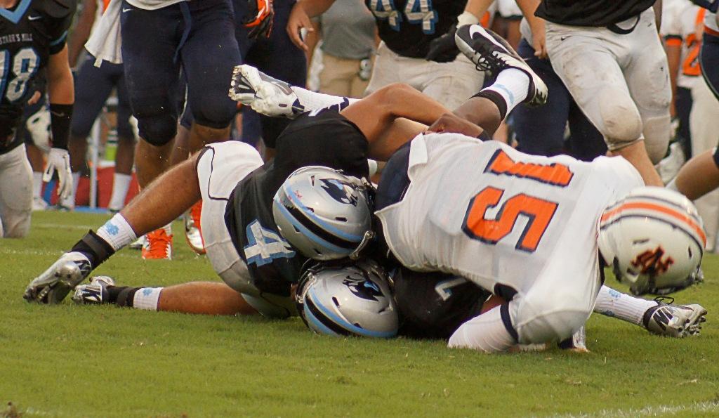 Senior defensive backs Hayden Beyer and Joshua Roberts gang tackle North Cobb’s quarterback Tyler Queen. 