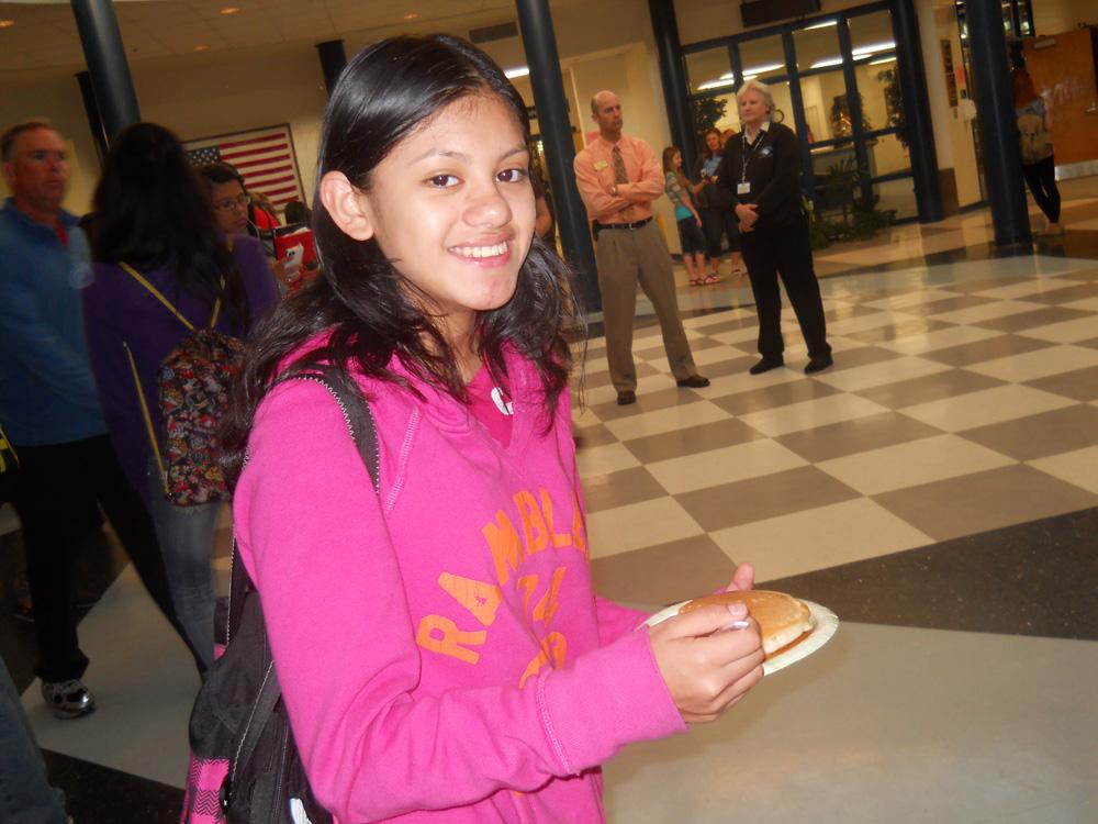 Freshman Andrea Rivera grabs a late pancake breakfast in the rotunda.