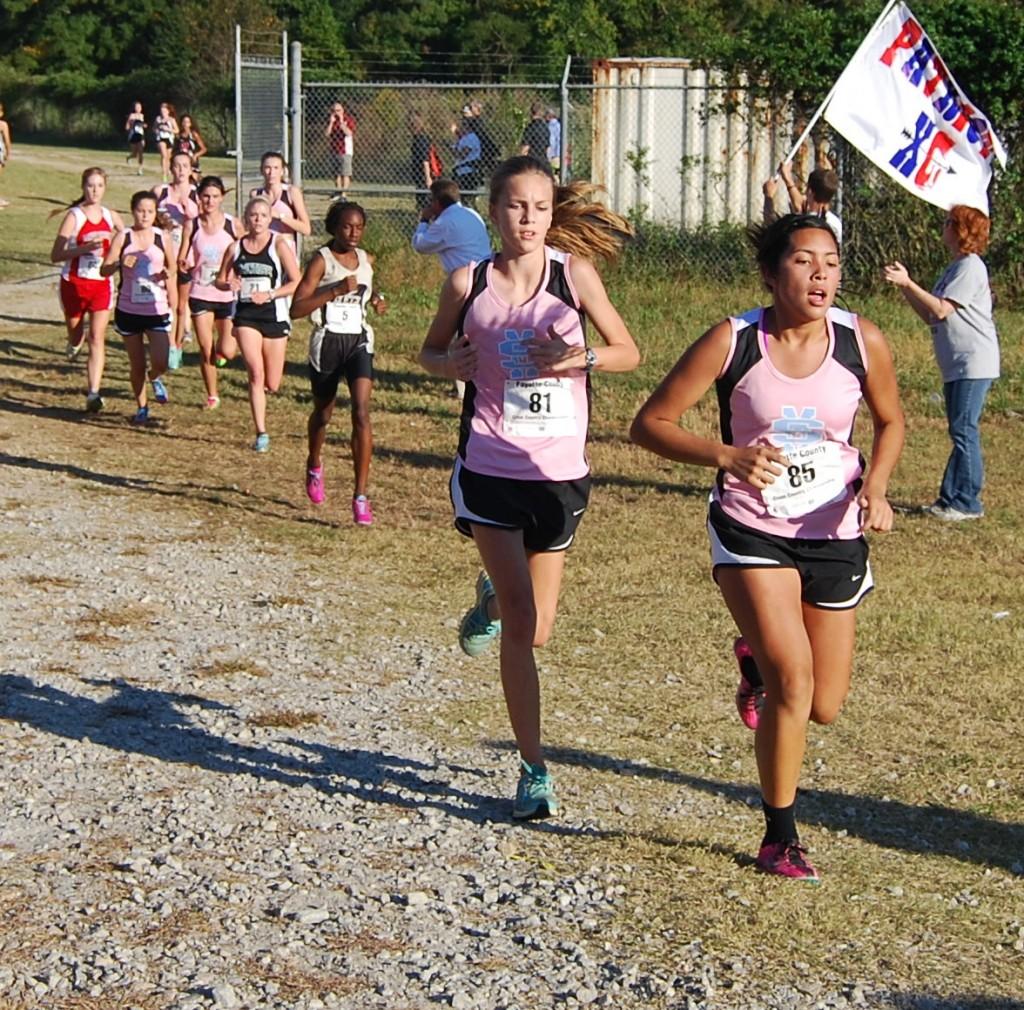 Junior Jazmin Zambrana and freshman Tori Nails lead the pack during the Fayette County Championships on Oct. 17.