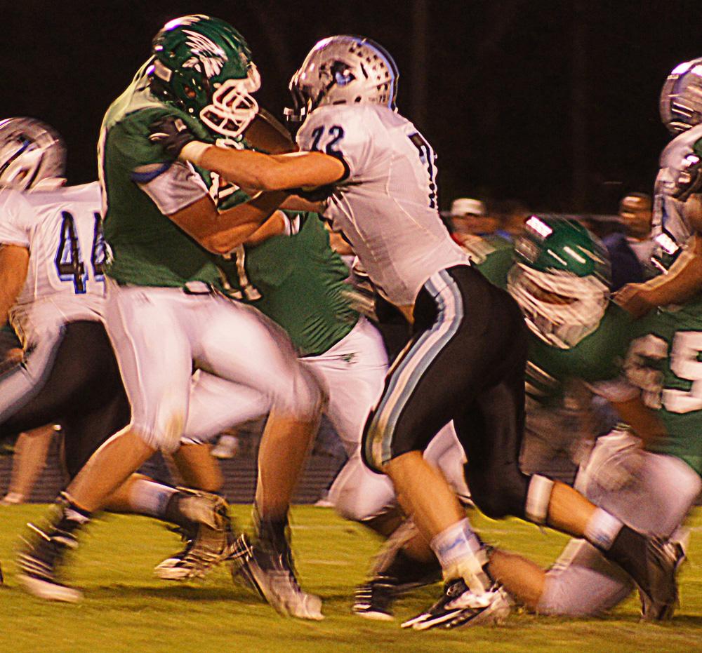 Senior defensive end Kery Ostrowski works his way around a lineman to make a tackle. The Panther defense allowed 168 rushing yards and 172 passing last Friday. 