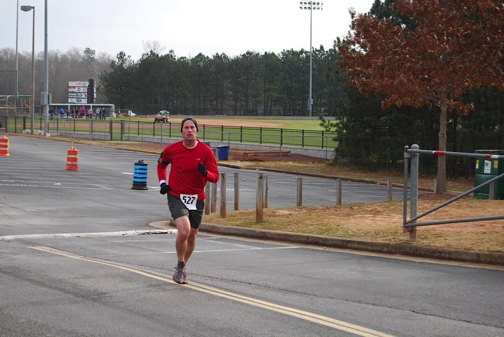 Vice Principle Allen Leonard charges up a hill toward the second mile of the race. 