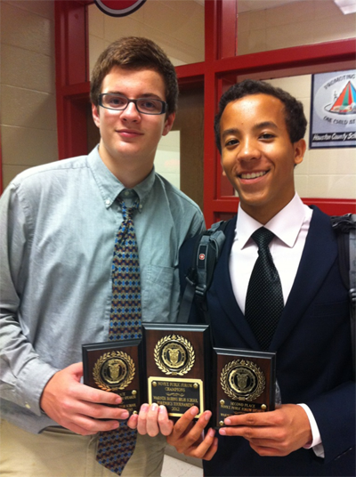 Sophomores David Brunskole (right) and Omer Mehovic are all smiles after their second debate win in the novice Public Forum  bracket at the Sequoyah Tournament in November.
