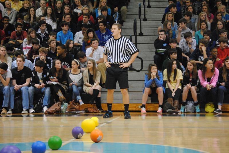 Senior Grant Aasen, doubling as the dodgeball referee gets ready to blow his whistle and start the game.