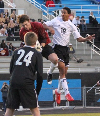 Junior Tylan Jones challenges the Forest Park goal keeper on a corner kick in their win 2-0 Thursday night. 
