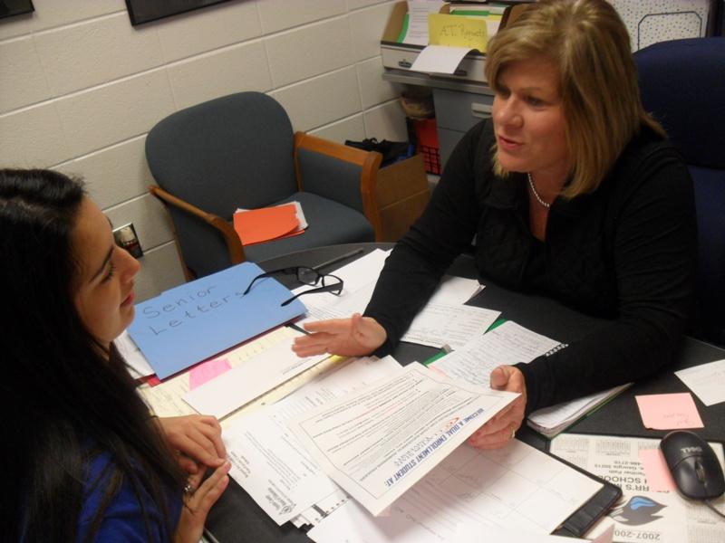 Junior Sue Utt discusses Advanced Placement and Dual Enrollment
courses with guidance counselor Colleen Petty.