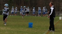 Second-year coach Jeff Schmidlkofer directs offense vs. defense drills at practice. 
