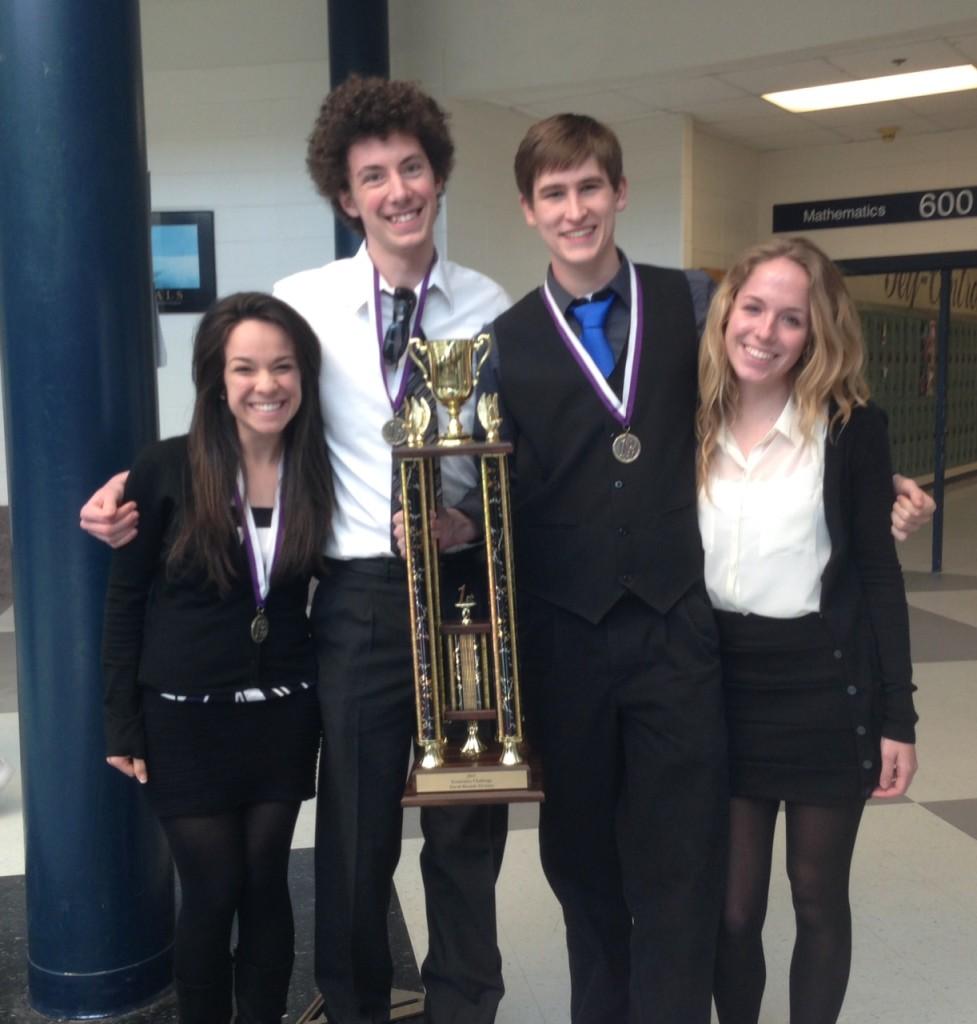 (Left to right) Leslie Perez, Donald Shoaf, Jeremiah Smith and Jessica Richey celebrate after their Econ Challenge state victory. 