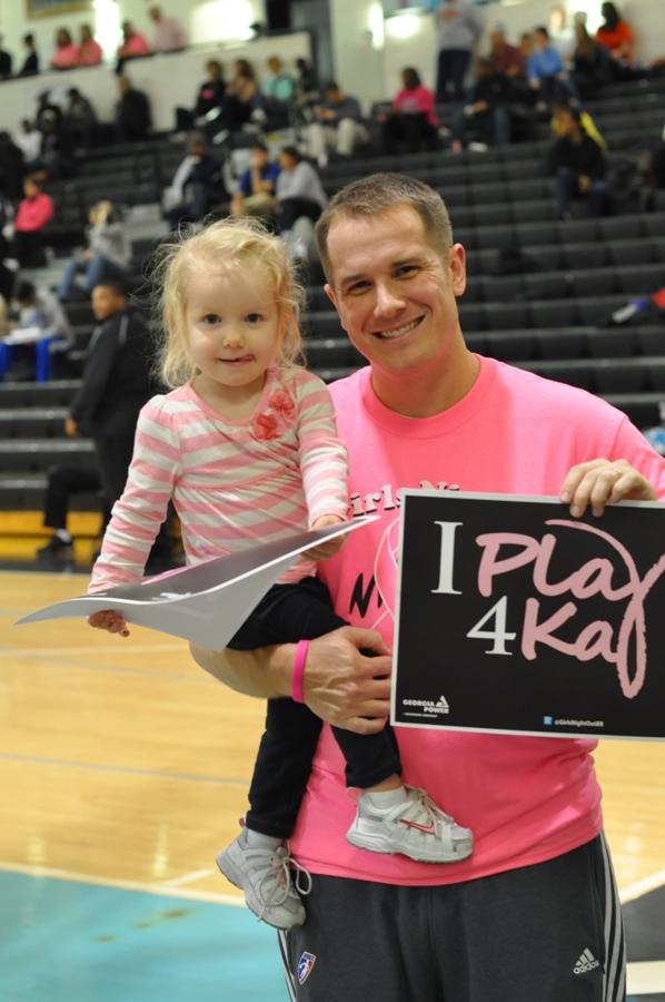 History and event coordinator Whitt Jones and his daughter enjoy their time together between games featuring top-ranked players and teams. 