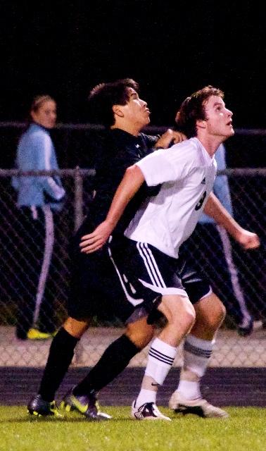 Senior Kyle Ulversoy (right) boxes out a Union Grove forward on a corner kick in their March 19, 3-0 win. 