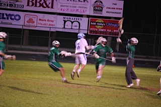 Senior Kevin Yoggy takes a jumping shot to tie the game against McIntosh 2-2 at the beginning of the second quarter on March 25.  