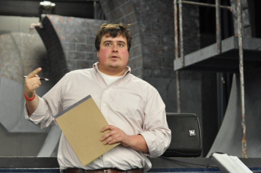 Zach Stutts, the assistant director and music director for "Urinetown," pitches an idea during one of the many rehearsals in the Wille Duke Auditorium.  Stutts was here everyday after school for months to help the cast and crew prepare for the three-night show.