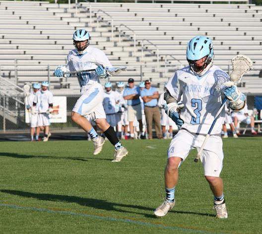 Senior Kevin Yoggy (3) sets up an attack play as senior Grant Aasen (30) runs upfield to get into position in the Panthers 9-8 overtime win against Lovett last Thursday night. 