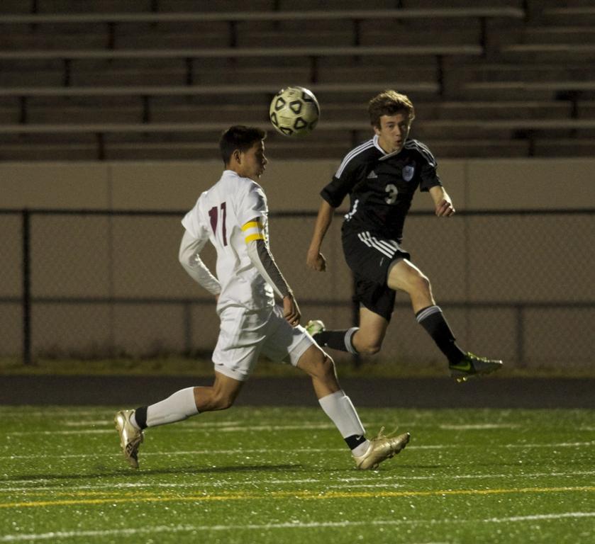 Junior Walter Hix (right) attempts to cross the ball into the ball against Allatoona, who the Panthers defeated 1-0 on Saturday to advance to the semi-finals. 