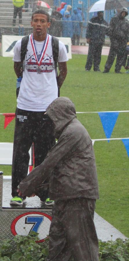 After battling through the rain in the 300-meter hurdles race, sophomore Taylor Brunskole stands seventh in the state on the finishers podium. This was great experience for next year, Brunskole said. Hopefully I will be able to come back and try to finish first.