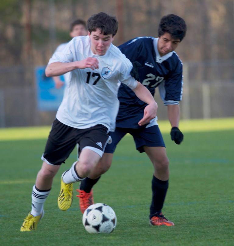 Sophomore Tristen Ulversoy (left) challenges a Houston County defender for the ball during the Panthers 5-0 loss in the semi-final round of the state AAAAA playoffs. 
