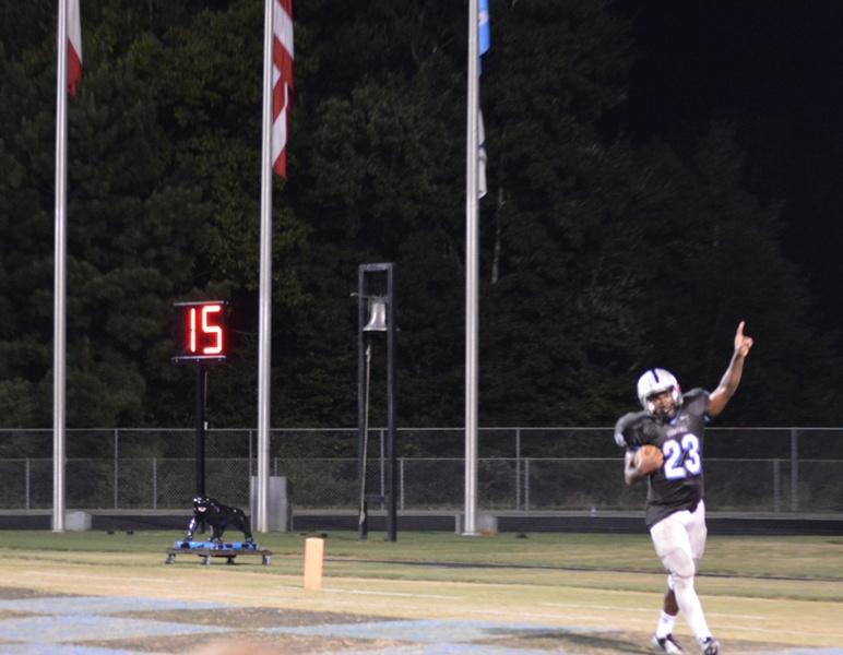 Senior John Smith celebrates one of  the three touchdowns he scored against West Forsyth on Sept. 13. The Panthers lost a close one, 33-29. 