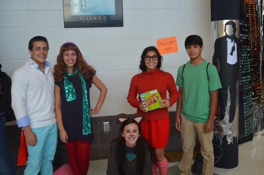 Sophomores John Cox (in the white shirt, far left), Jessie Ricuad (in the purple dress, middle left), Bianca Bringuel (in the orange sweater and skirt, middle right), Jena Smith (in the dog costume, middle) , and freshman Alex Bringuel (in the green shirt, far right) dressed as the gang from Scooby Doo for Character Day, which started the Spirit Days for Homecoming Week.  
