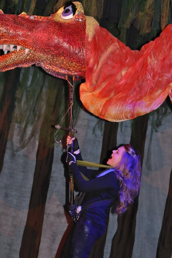 Junior Abigail Feltner wows the crowd with her ability to sing and dance, while also controlling the head of a 24-foot dragon. 
