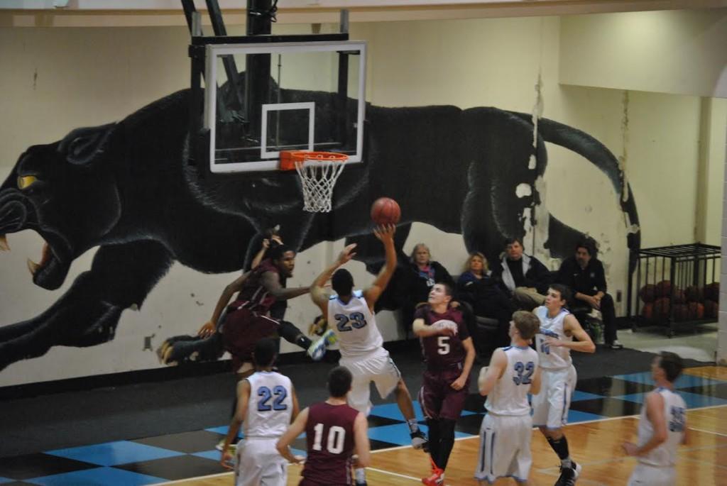 After driving the lane, Jeremiah Vrudny (23) takes the ball up for a tough shot against Whitewater on Jan. 24.