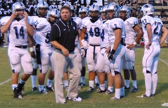 Head coach Chad Phillips looks to the sidelines to communicate with his coaches during a time out in the first half.  The Tigers were on the move and Phillips wanted to discusses strategy with his defense. 