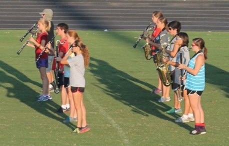 Marchers warm up on the field at practice. 