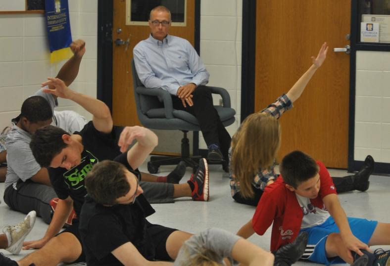 David Spearman supervises the casts pre-rehearsal warmups for The Addams Family.