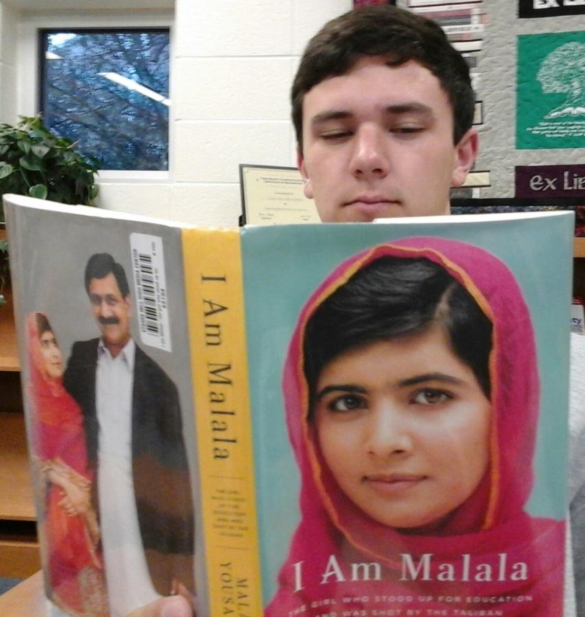 Junior+Michael+Egan+reads+the+autobiography+of+Malala+Yousafzai.+%0D%0A