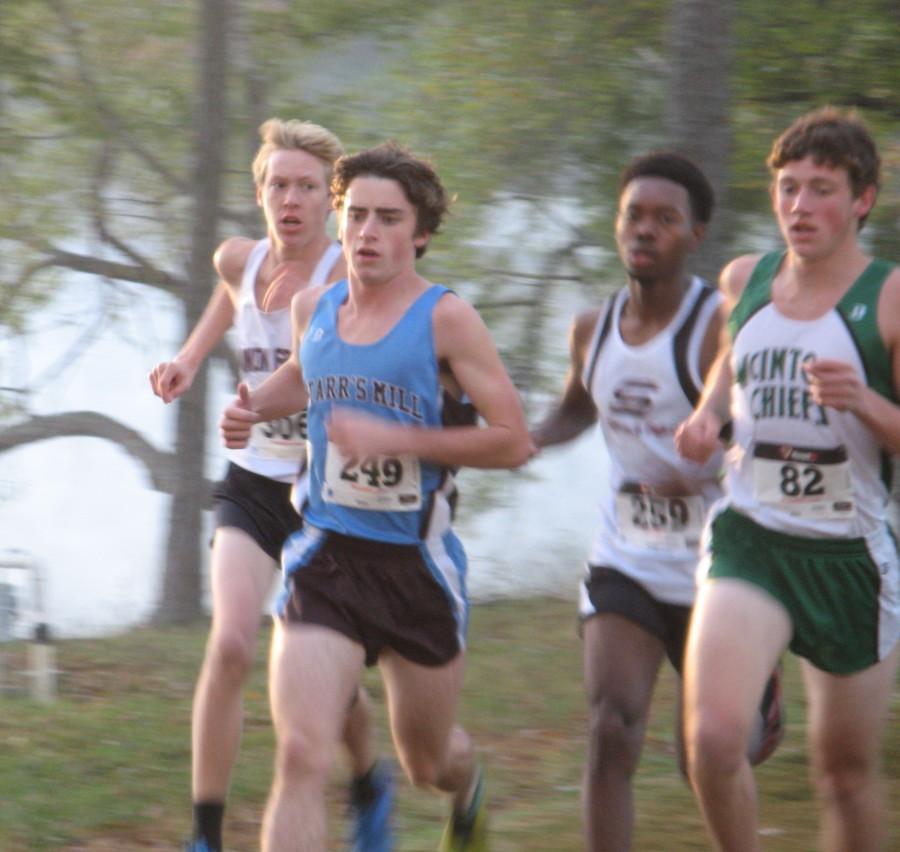 Top runner for the boys' team, Josh Warren,  sprints his way to victory at the Region meet. 