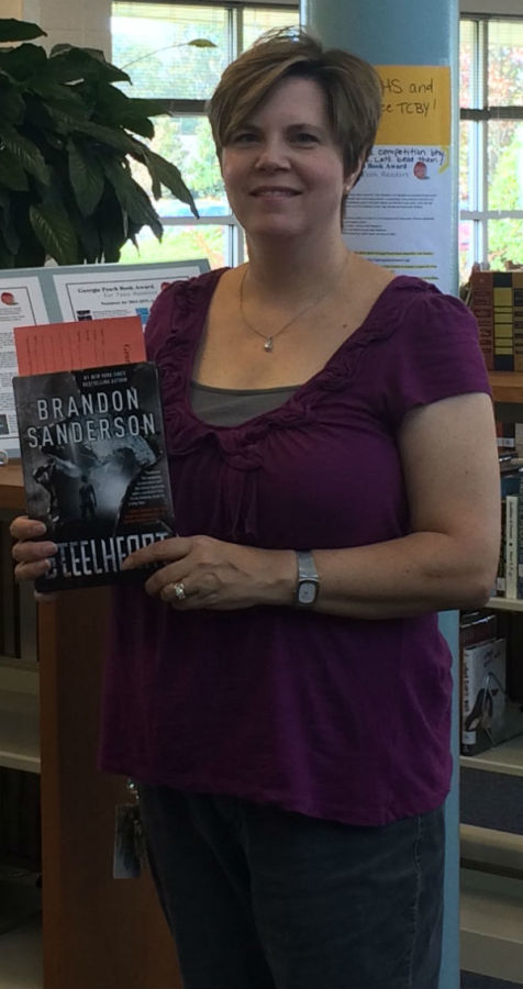 Media specialist LeighAnne Hanie presents Brandon Sanderson's "Steelheart" as one of the book nominees for the Georgia Teen Peach Book Award. 