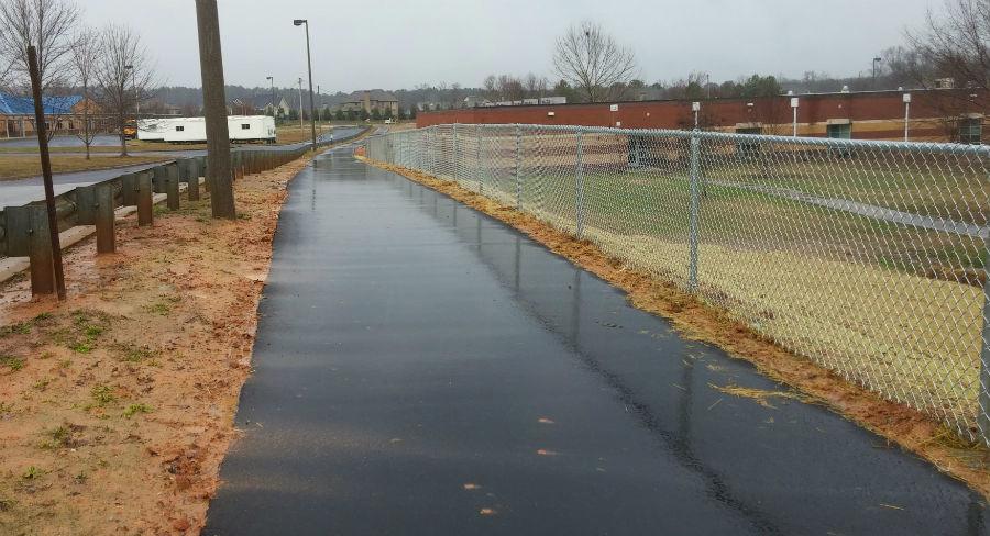 A 1000-foot path connects the crossing at Panther Path to the finished golf cart parking lot. This path safely allows golf carts to drive to the lot without ever mingling with the cars. 
