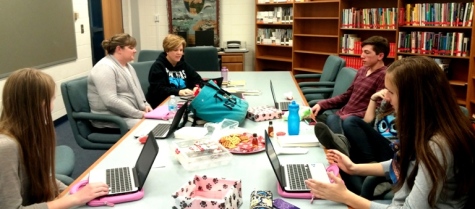 Ex Libris officers and sponsors meet to discuss plans for their upcoming annual read-a-thon. 