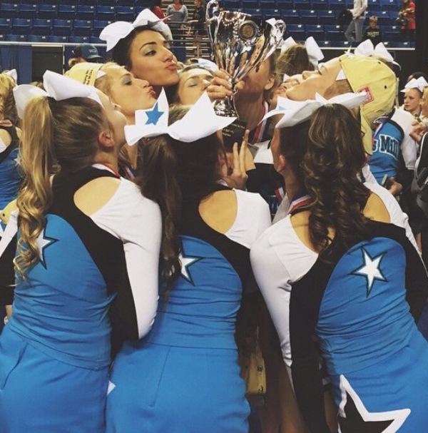 With trophy in hand, the cheerleaders celebrate their victory after the competition.
