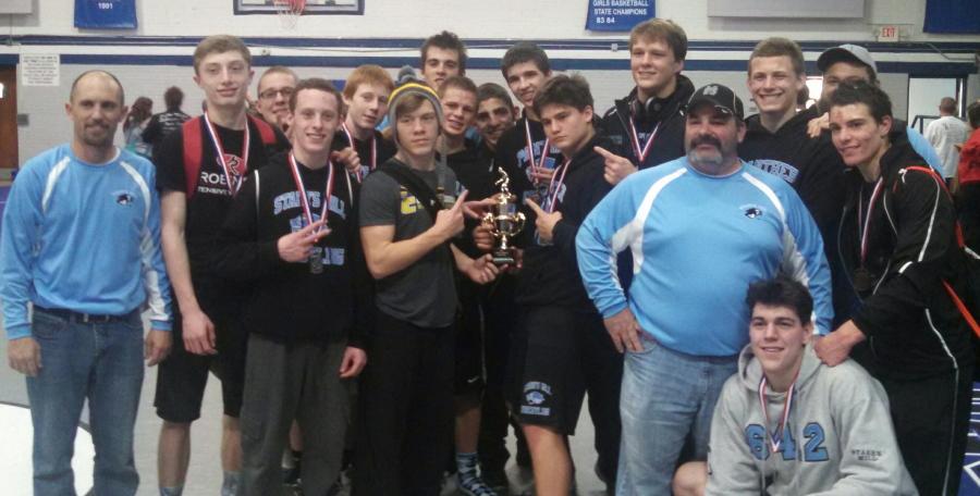 The+Wrestling+team+poses+after+being+awarded+the+second+place+trophy+at+the+Chattahoochee+River+Invitational+on+Dec.+14.