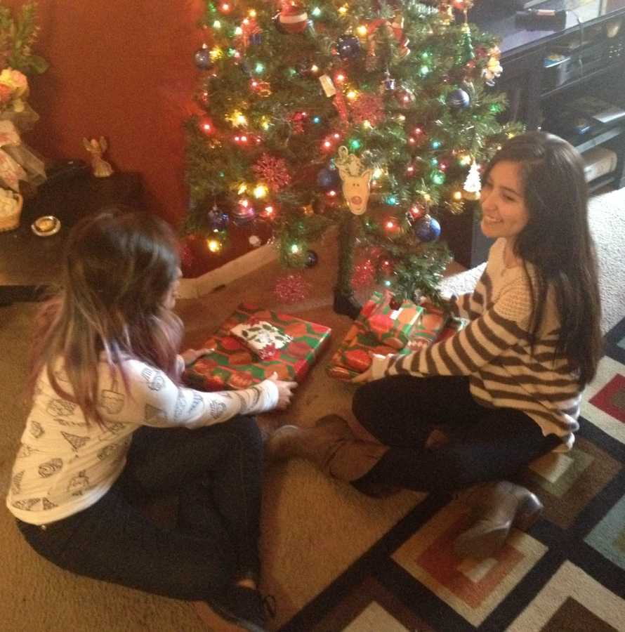 Sophomore Letty and Senior Maria Castillo placed their newly wrapped Christmas gifts under their tree. 