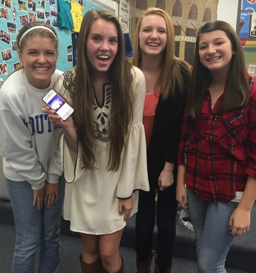 Hollyn Shadinger and some chorus friends are excited about her song Maybe Love Will Last on iTunes.