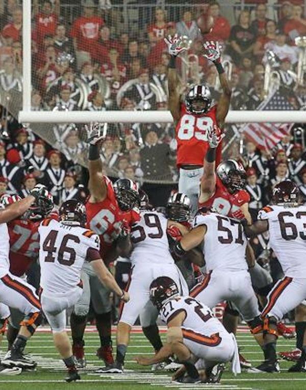 Jeff Greene (89) jumps over the line-of-scrimmage in an attempt to block a kick during a week two match-up against the Virginia Tech Hokies. 