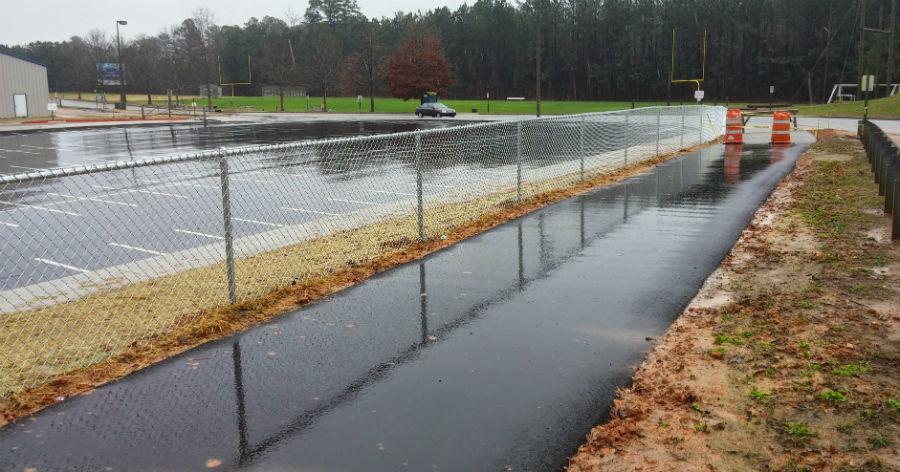 A newly constructed golf cart path between Peeples Elementary and Rising Starr Middle connects the crosswalk at Panther Path to the golf cart parking lot.