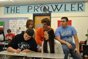 Junior Jack Fletcher signs his contract for his third year in Journalism as Sports Editor. 