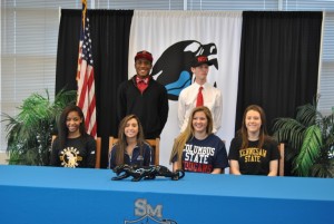 Seniors Chayla Park (from left), Jahmeil Curwen, Kayla Feigenbaum, Sam Roberson, Paige Betsill and Carly Pressgrove sign letters of intent to play soccer at various universities in the fall. 