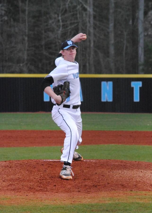 Senior pitcher and first baseman Adam Goodman throws a pitch at a home game. In his first four games, he had not allowed a run in nine and two thirds innings while allowing five hits and recording 16 strikeouts. 
