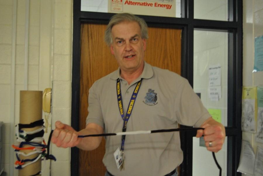 Engineering teacher Jonathan Winkjer shows a section of a pipe-cleaner chain he created to test the concept and its strength.