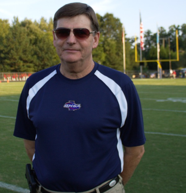 New Georgia High School Association Executive Director Gary Phillips stands on the football field at Starrs Mill before a Panthers home game. He was elected with a unanimous 52-0 vote by the Board of Trustees. 