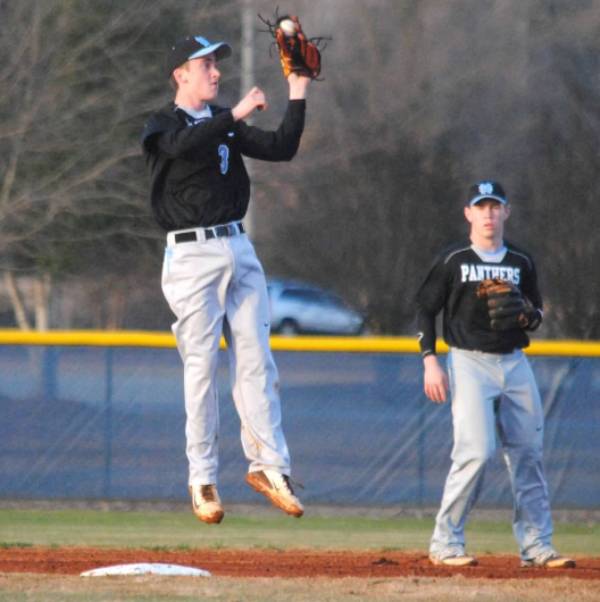 Junior shortstop and pitcher Richie Post makes a leaping catch at second base in the game at Jeff Davis. He is batting .471 on the year. 