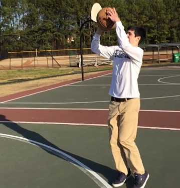 Sophomore JC Talbott prepares to shoot at Oak Grove park. 