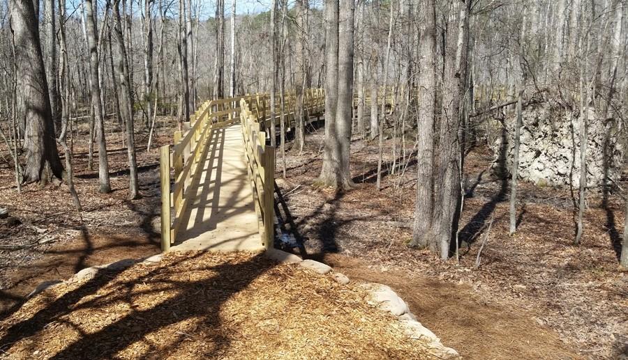 An extended bridge leads walkers over the wetlands and ends at Beaver Pond.