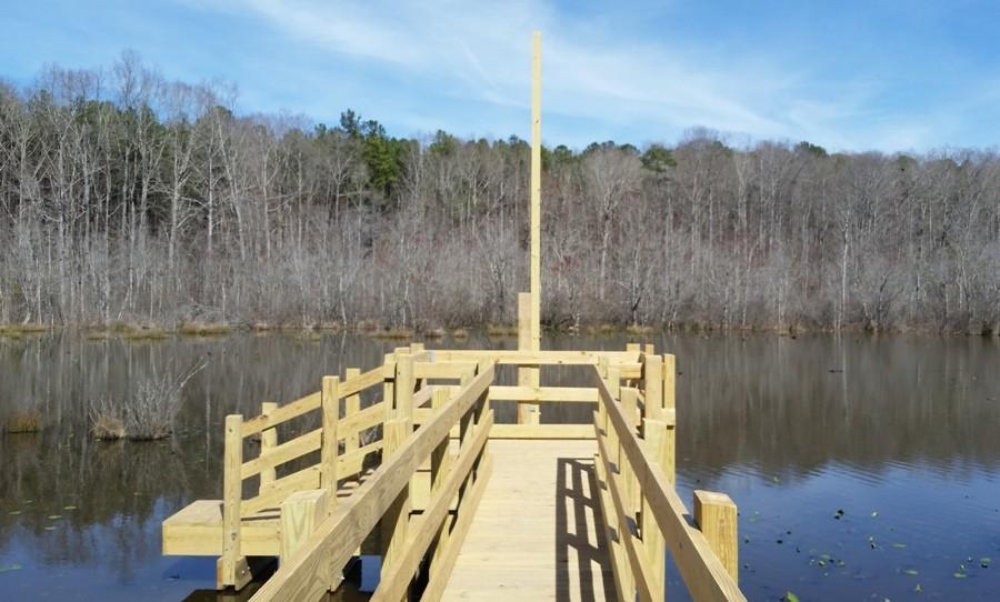 A pole at the end of the bridge will soon host a nature camera to observe the beavers living in the pond.