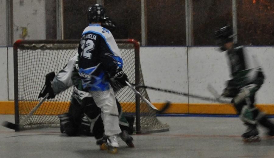Junior Cameron Serapiglia scores a goal in the second period by evading the Chiefs' tough defense.